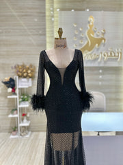 A stunning gold, off-the-shoulder maxi dress with a flowing skirt, perfect for a summer evening party.